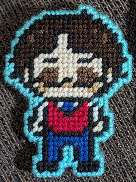 A yarn figure of the streamer Professor Lando
